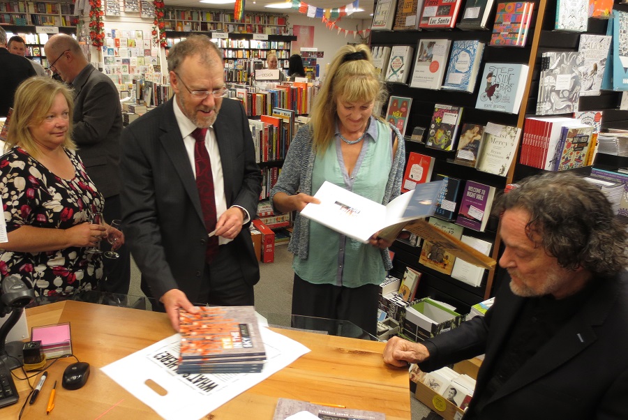 Grant gets ready to sign copies of the book.